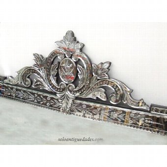 Antique Venetian wall mirror and carved crest crowned