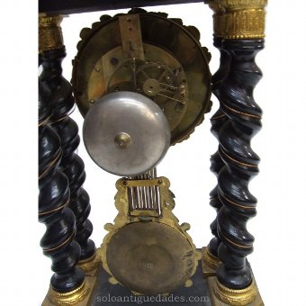 Antique French portico clock. Pendulum planting scene
