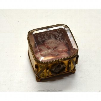 Small gold metal jewelry and glass