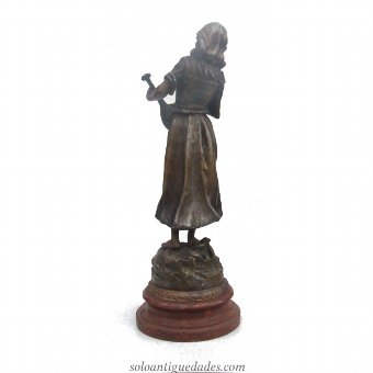 Antique Female sculpture playing an instrument
