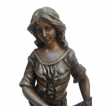 Antique Female sculpture playing an instrument