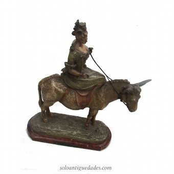 Female sculpture on a donkey