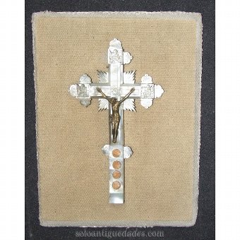 Pearl and bronze crucifix on wood