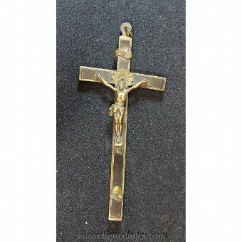Wooden cross framed in bronze