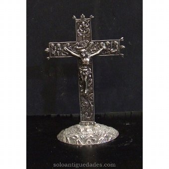 Silver crucifix decorated with reliefs