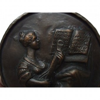 Antique Relief with fiddling wife