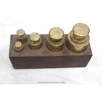 Antique Game five brass weights with wooden base