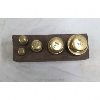 Antique Game five brass weights with wooden base