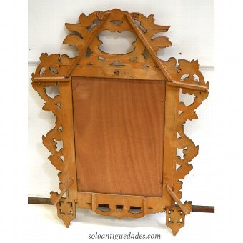 Antique Louis XVI style mirror with large wreath and crest center