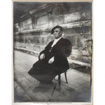 Antique Photo of man sitting in armchair