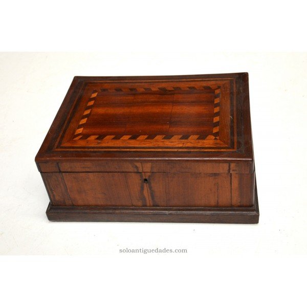 Wooden box with inlaid geometric shapes