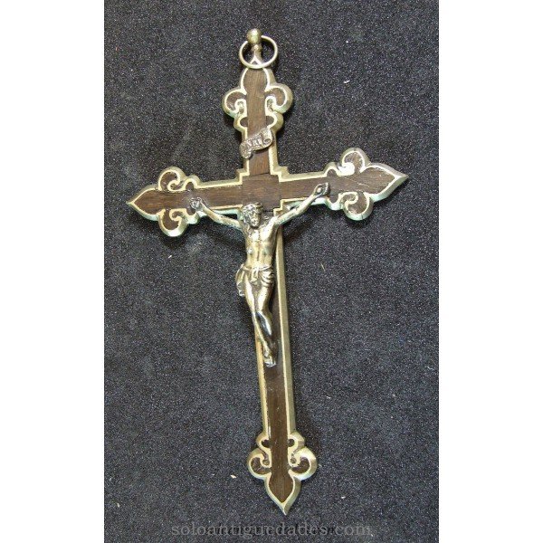 Wooden crucifix framed in silver