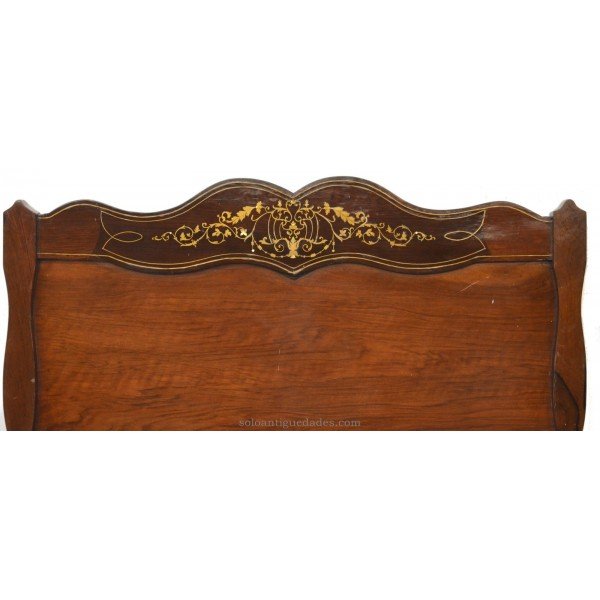 Old headboard with elegant decor