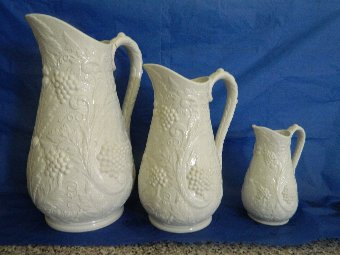 Three graduated salt glaze jugs