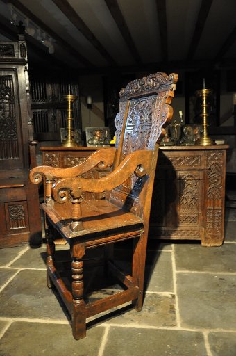 Antique A HANDSOME MID 17TH CENTURY CARVED OAK WAINSCOT ARMCHAIR. ENGLISH. CIRCA 1650 