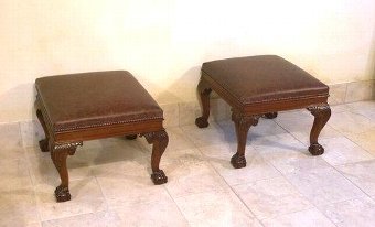 Rare pair of Chippendale style leather stools