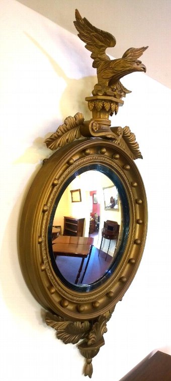 Antique Round gilt mirror with impressive eagle mount