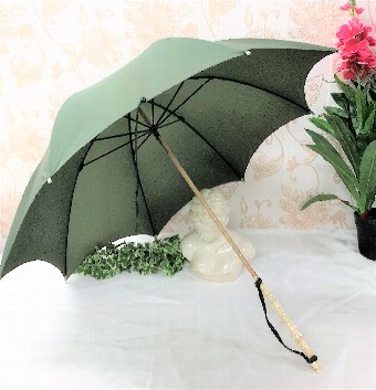 A 19th Century Green Parasol with Ivory Handle
