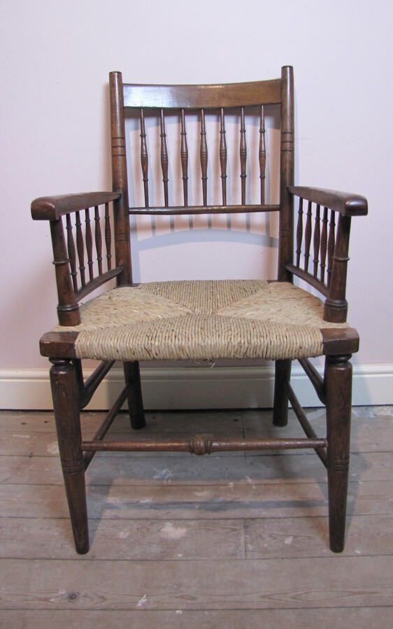 William Morris spindle back oak armchair