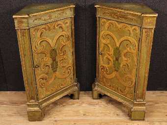 Antique Pair of lacquered and gilded Lombard corner cupboards of the 20th century