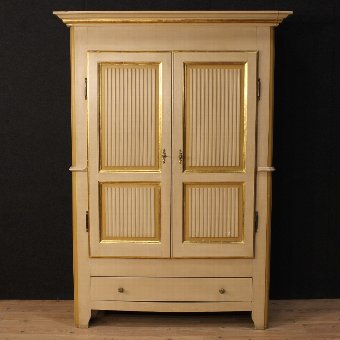 Antique Italian wardrobe in lacquered and gilded wood