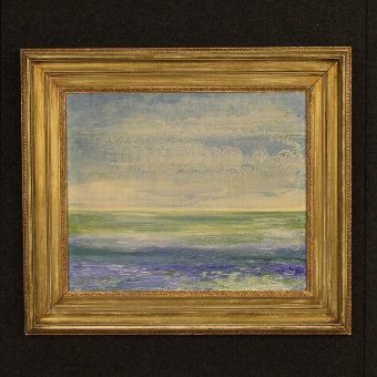 Impressionist painting depicting seascape with silver frame