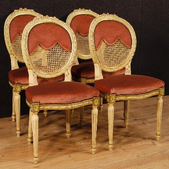 Group of four lacquered and golden chairs in Louis XVI style