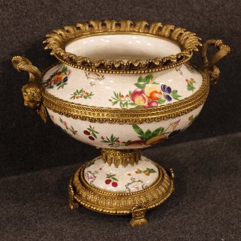 Ceramic cup with golden bronze decorations