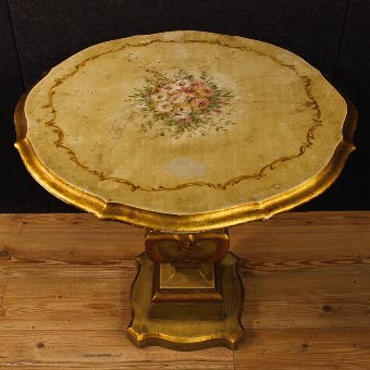 Antique Italian lacquered, golden and painted side table with floral decorations