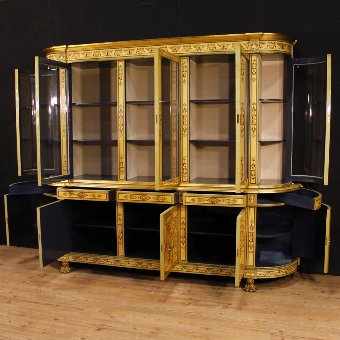 Antique French bookcase in inlaid wood with golden bronzes
