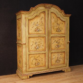 Italian wardrobe in lacquered and painted wood with floral decorations