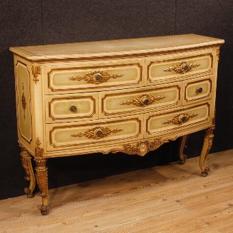 Italian chest of drawers in lacquered and gilded wood