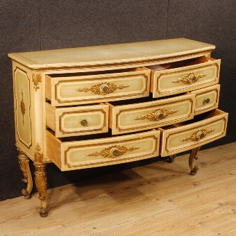 Antique Italian chest of drawers in lacquered and gilded wood