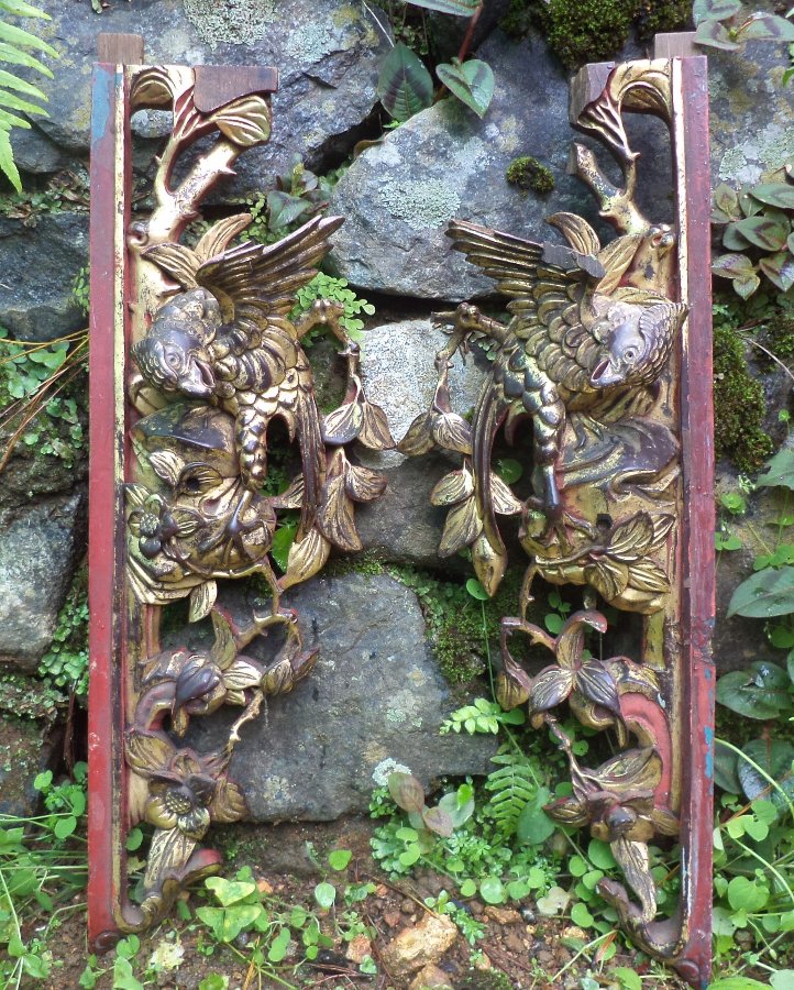 A Pair of Carved Lacquer Panels of Birds and Flora