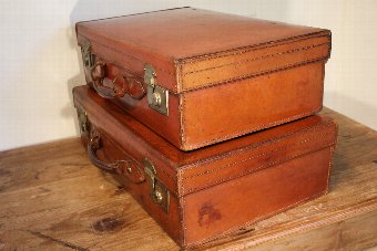 Antique Two matched vintage leather suitcases - Harrods of London