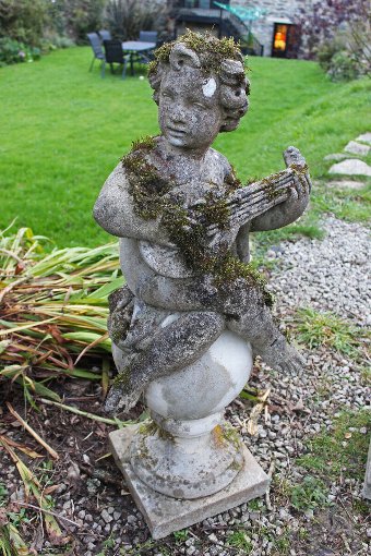 Antique Ornamental garden Statues. Four weathered classical figures of Putti on Ball Finials