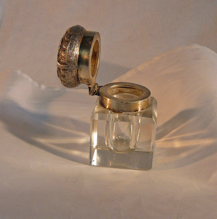 ANTIQUE GLASS INKWELL WITH WHITE METAL DECORATIVE TOP