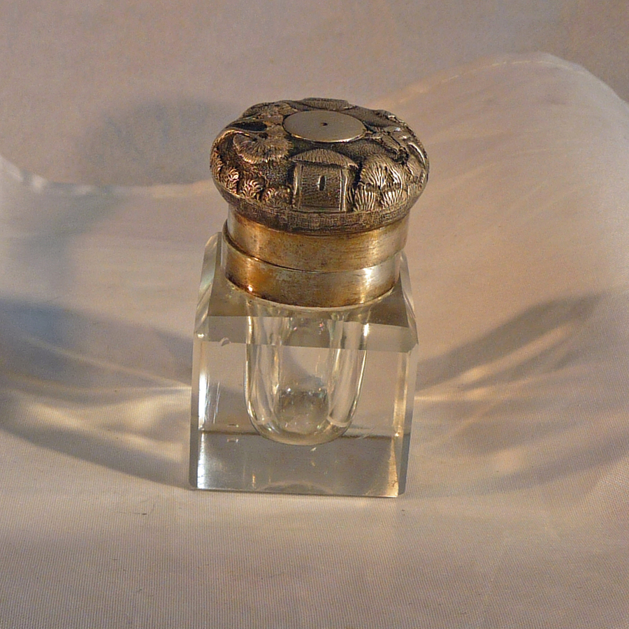 Antique ANTIQUE GLASS INKWELL WITH WHITE METAL DECORATIVE TOP