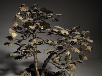 Antique Bronze Bonsai, A very decorative and beautiful made miniature tree, standing on a natural rock (possibly lava)