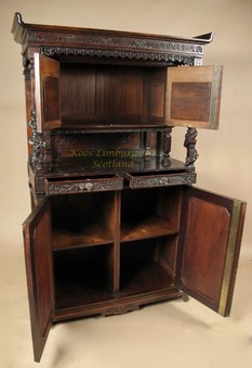 Antique Japonism. Aesthetic movement. A very interesting European walnut cupboard, mounted with Japanese lacquered panels.