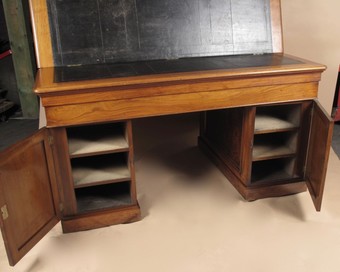 Antique An exceptional and rare mahogany and burr walnut writing/ partner desk.