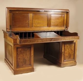 Antique An exceptional and rare mahogany and burr walnut writing/ partner desk.