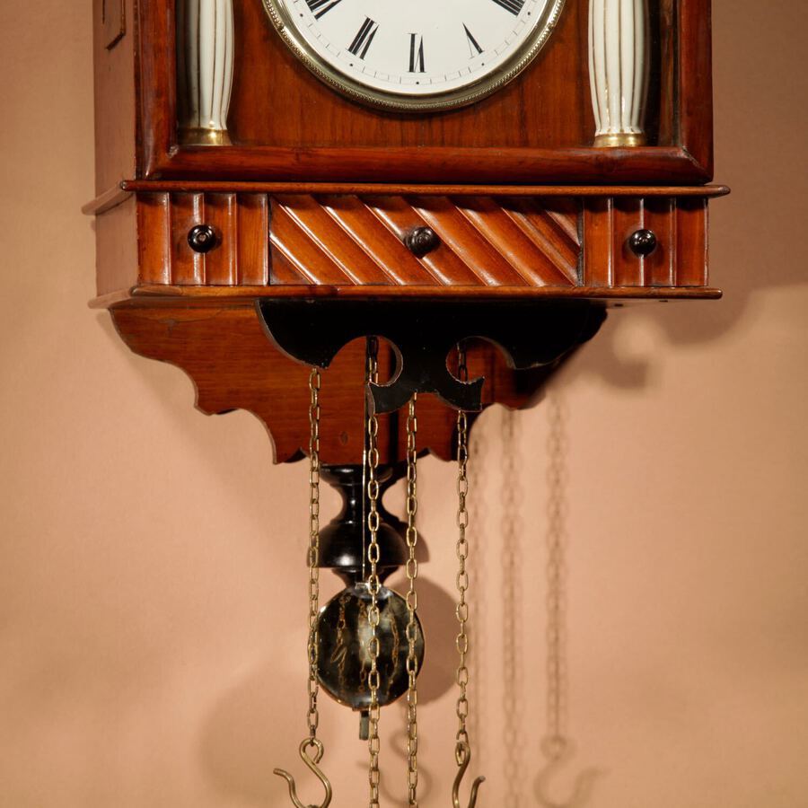 Antique A Very Decorative and Original Black Forest Fruitwood and Ebonised Wall Clock.