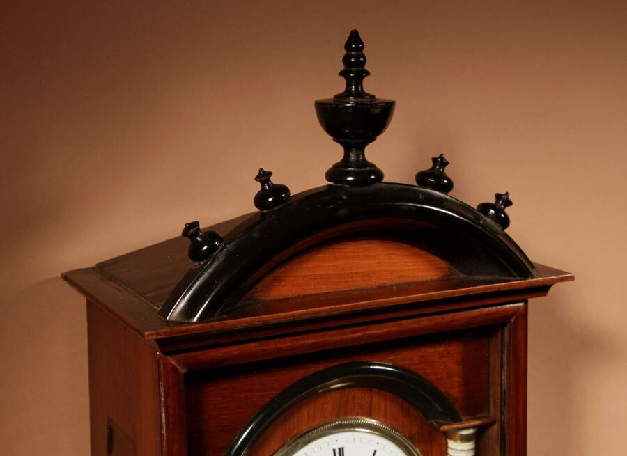 Antique A Very Decorative and Original Black Forest Fruitwood and Ebonised Wall Clock.