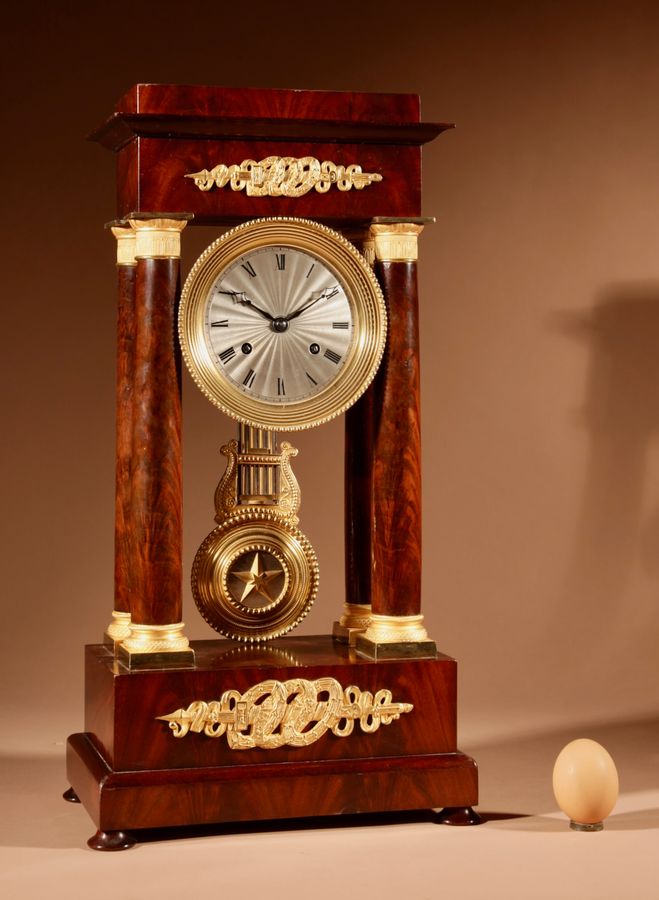A Finely Made Louis Philippe Mahogany and Ormolu Portico Clock Circa: 1830-1837