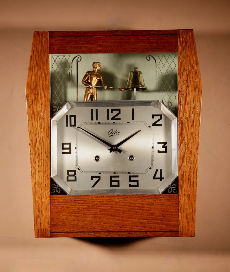 A French Art Deco Style Oak Signed Odo Automation Striking Wall Clock.