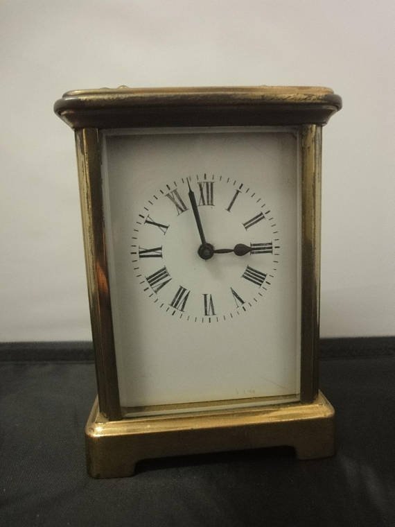 French Carriage Time Piece with a white enamel dial 8 day movement in brass case
