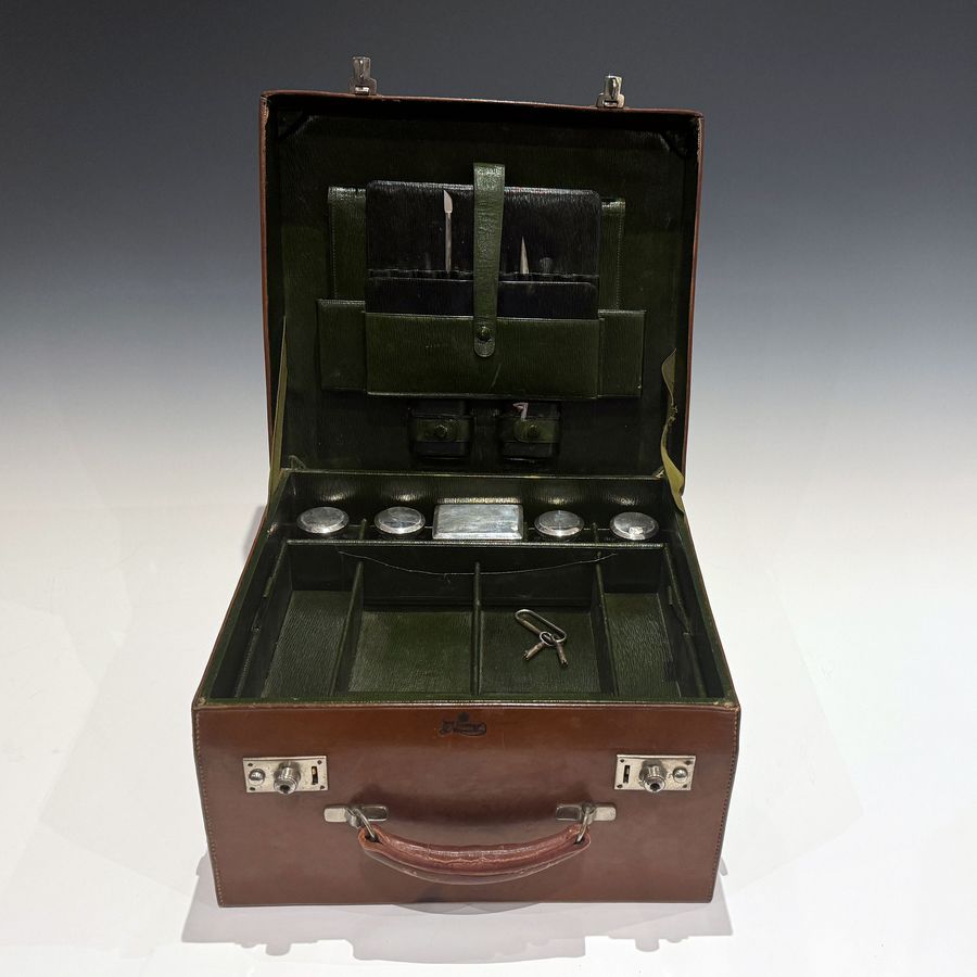 Antique #101673 J C Vickery Regent St. An Early 20th Century Cowhide Travel Dressing Case.