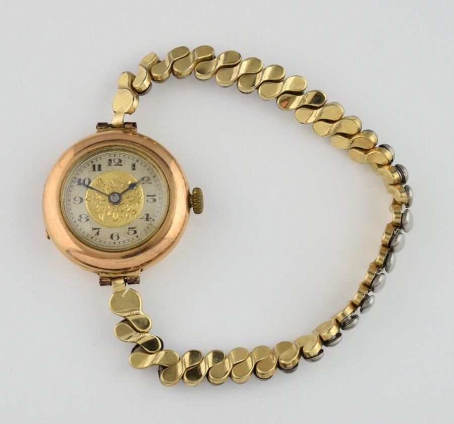 Antique Ladies gold wrist watch, round dial with Arabic numerals and ...