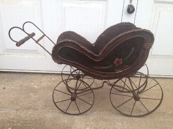 Rare and fine example of a late 19th early 20th century child’s painted wooden dolls pram with a ...